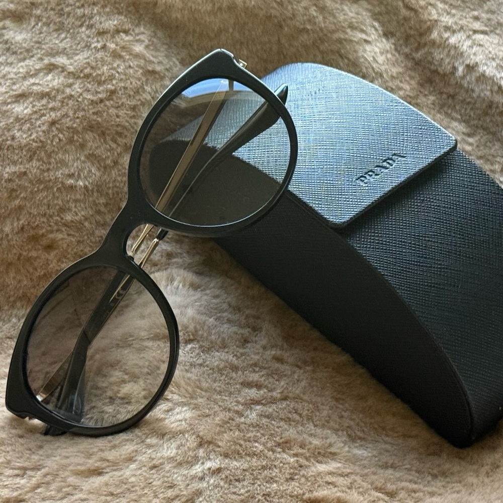 Prada Elegant Black Eyewear with Case